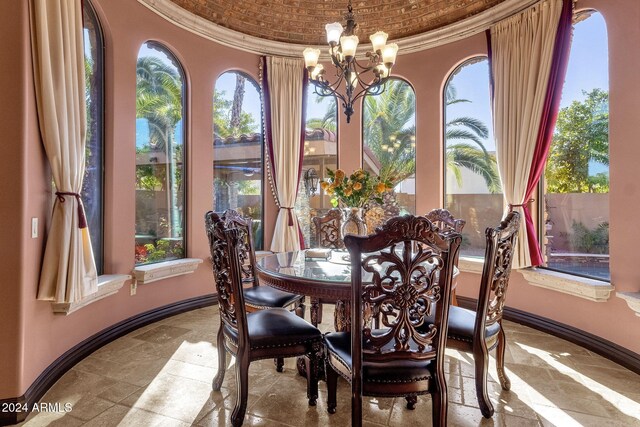 dining area featuring ornamental molding, a wealth of natural light, and baseboards