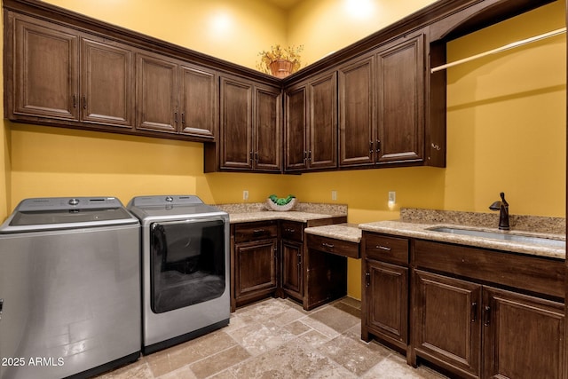 4301 E Taurus Pl, Chandler, AZ 85249 - laundry room featuring cabinet space, washing machine and dryer, and light stone finish flooring