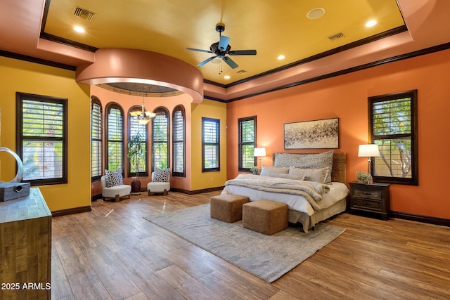 4301 E Taurus Pl, Chandler, AZ 85249 - bedroom with a raised ceiling, crown molding, wood finished floors, and a chandelier