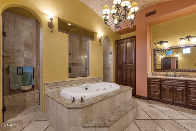 bathroom with lofted ceiling, vanity, visible vents, a whirlpool tub, and a stall shower