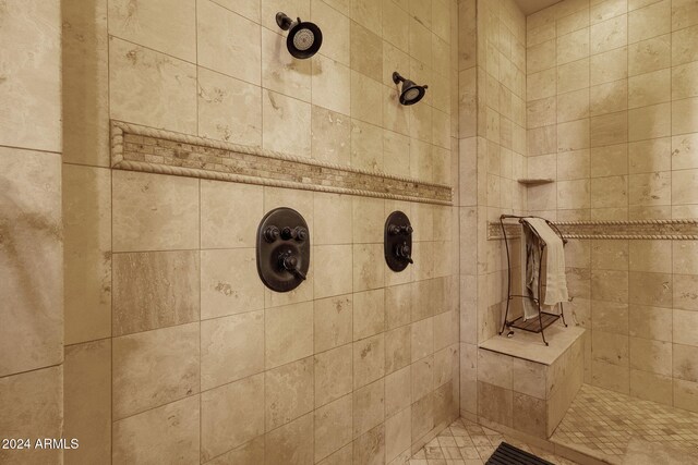 bathroom with a tile shower