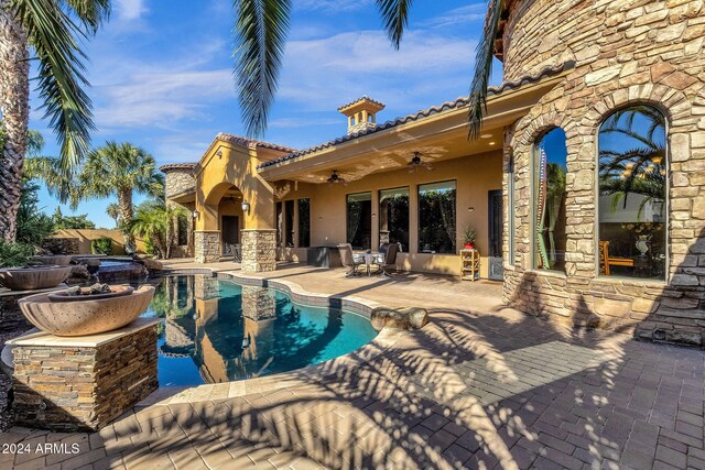 pool featuring a patio and a ceiling fan