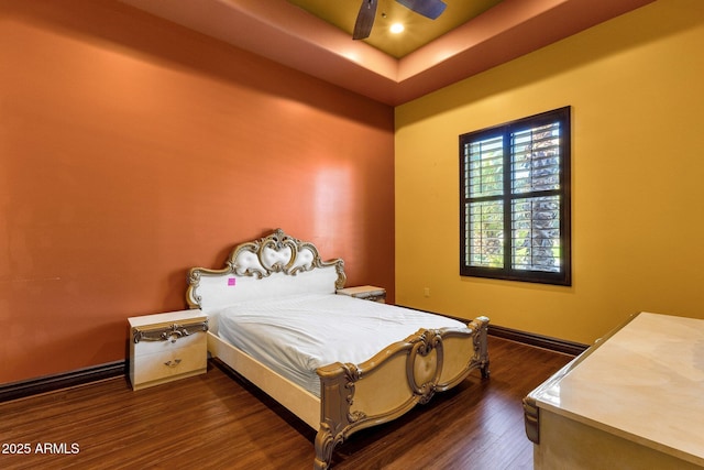 4301 E Taurus Pl, Chandler, AZ 85249 - bedroom featuring wood finished floors, a raised ceiling, and a ceiling fan
