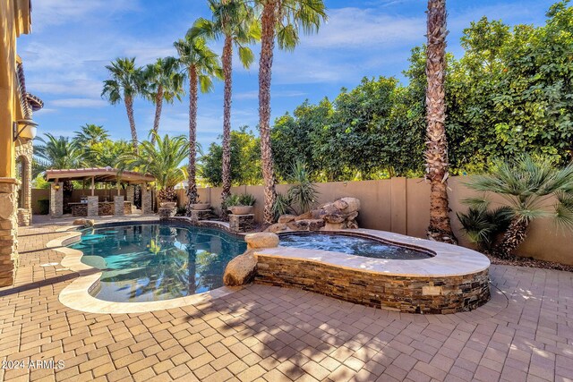 view of swimming pool featuring a fenced in pool, a patio area, a pergola, an in ground hot tub, and a fenced backyard