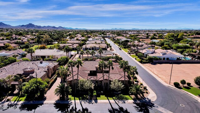 birds eye view of property featuring a mountain view and a residential view