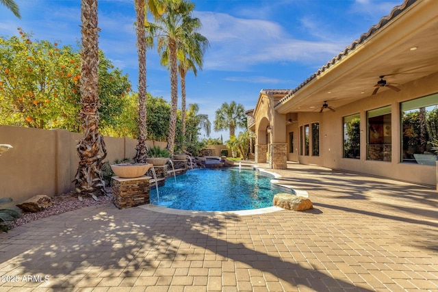4301 E Taurus Pl, Chandler, AZ 85249 - view of swimming pool with ceiling fan, a patio, a fenced backyard, and a pool with connected hot tub