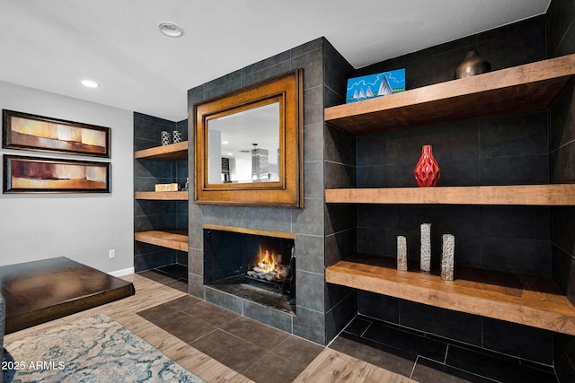 8730 E Montecito Ave, Scottsdale, AZ 85251 - detailed view of wood finished floors, baseboards, a fireplace, and recessed lighting