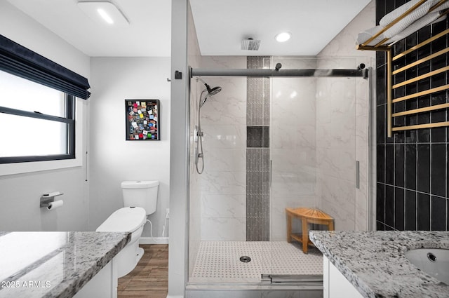 8730 E Montecito Ave, Scottsdale, AZ 85251 - bathroom with vanity, toilet, a shower stall, wood finished floors, and recessed lighting