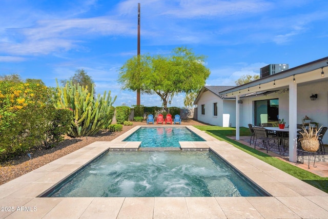 8730 E Montecito Ave, Scottsdale, AZ 85251 - view of pool with a patio area, central AC unit, a pool with connected hot tub, and a fenced backyard