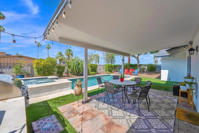 8730 E Montecito Ave, Scottsdale, AZ 85251 - view of patio / terrace featuring an in-ground hot tub and outdoor dining area