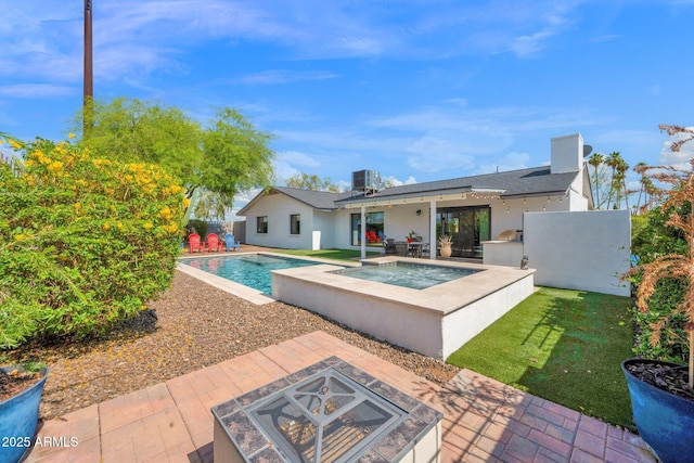 8730 E Montecito Ave, Scottsdale, AZ 85251 - swimming pool with a fire pit, an in-ground hot tub, a patio area, cooling unit, and an outdoor kitchen