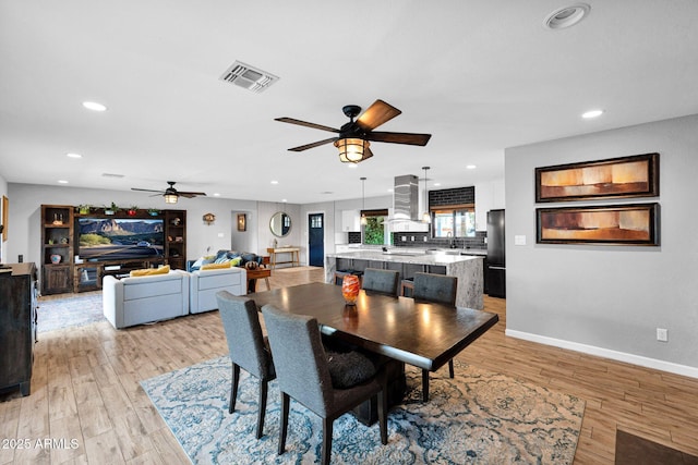 8730 E Montecito Ave, Scottsdale, AZ 85251 - dining space featuring ceiling fan, recessed lighting, light wood-style flooring, and baseboards