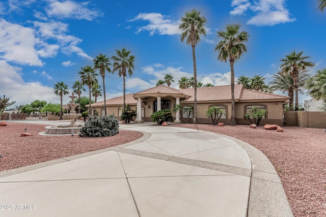 23644 N 67th Ave, Peoria, AZ 85383 - mediterranean / spanish home with a tiled roof, fence, and stucco siding