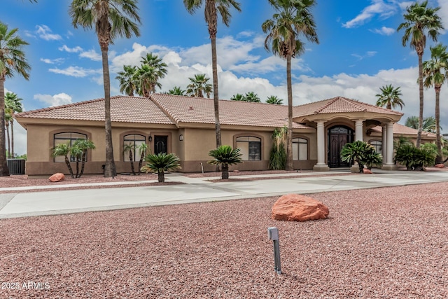 23644 N 67th Ave, Peoria, AZ 85383 - mediterranean / spanish home with central AC unit, stucco siding, and a tiled roof