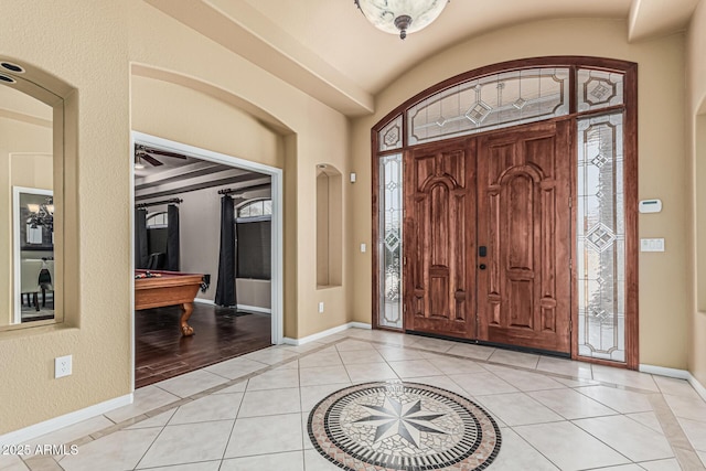 23644 N 67th Ave, Peoria, AZ 85383 - foyer entrance with baseboards, billiards, lofted ceiling, and light tile patterned floors
