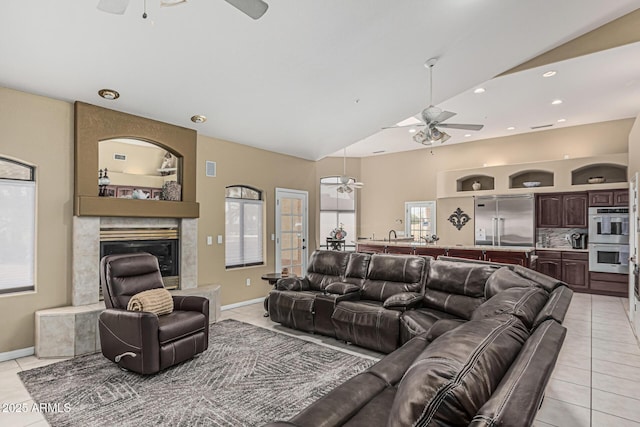 23644 N 67th Ave, Peoria, AZ 85383 - living room featuring a ceiling fan, a large fireplace, light tile patterned floors, lofted ceiling, and recessed lighting