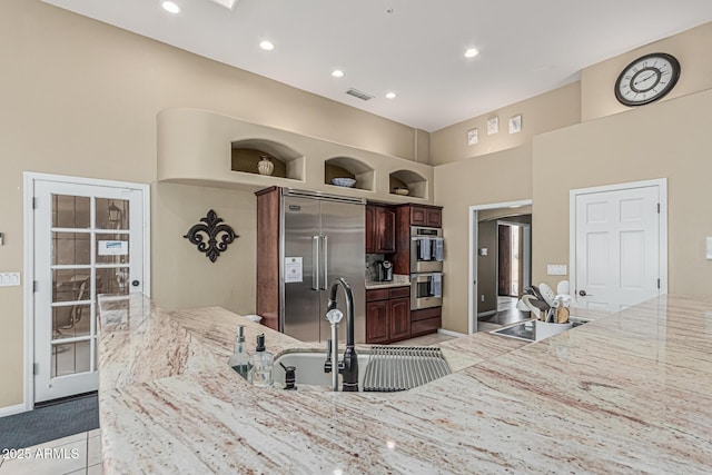 23644 N 67th Ave, Peoria, AZ 85383 - kitchen with visible vents, a towering ceiling, recessed lighting, a sink, and appliances with stainless steel finishes