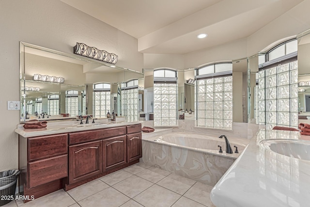 23644 N 67th Ave, Peoria, AZ 85383 - bathroom featuring a garden tub, a sink, two vanities, and tile patterned flooring