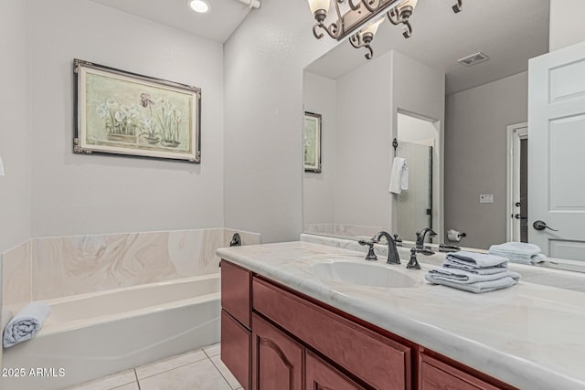 23644 N 67th Ave, Peoria, AZ 85383 - bathroom featuring visible vents, a bath, tile patterned floors, and vanity