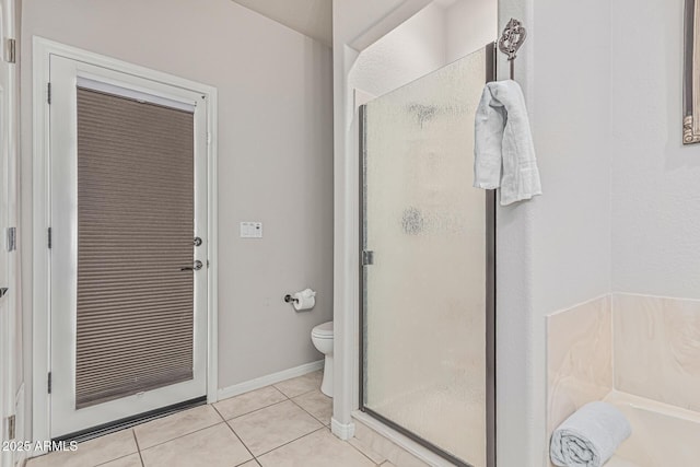 23644 N 67th Ave, Peoria, AZ 85383 - bathroom featuring tile patterned floors, a bath, a stall shower, and toilet