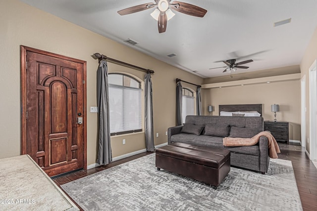 23644 N 67th Ave, Peoria, AZ 85383 - bedroom featuring visible vents, baseboards, dark wood-type flooring, and ceiling fan