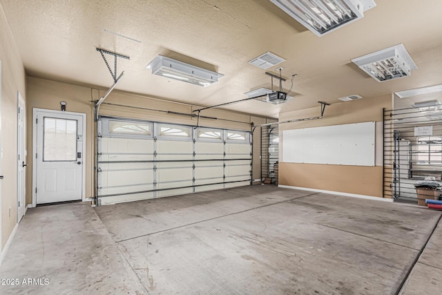 23644 N 67th Ave, Peoria, AZ 85383 - garage with baseboards and a garage door opener