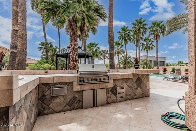 23644 N 67th Ave, Peoria, AZ 85383 - view of patio featuring a gazebo, exterior kitchen, a fenced in pool, and a grill