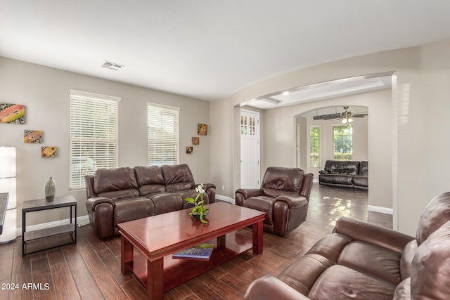 living room featuring a wealth of natural light and ceiling fan