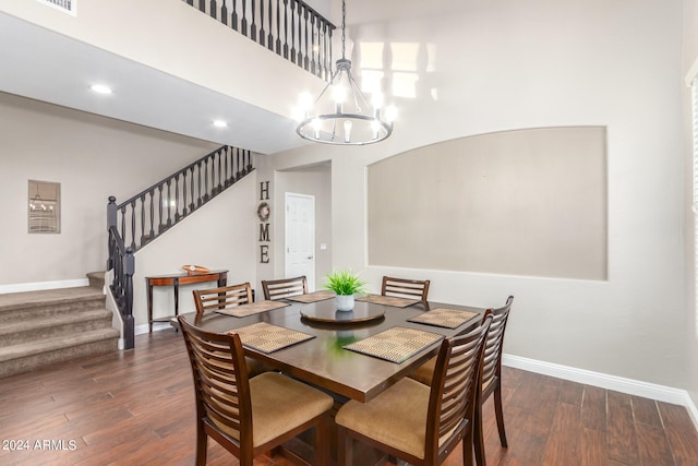 dining room featuring dark hardwood / wood-style floors and a notable chandelier