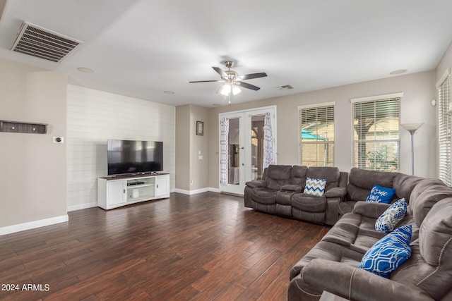 living room featuring dark hardwood / wood-style floors, ceiling fan, and french doors