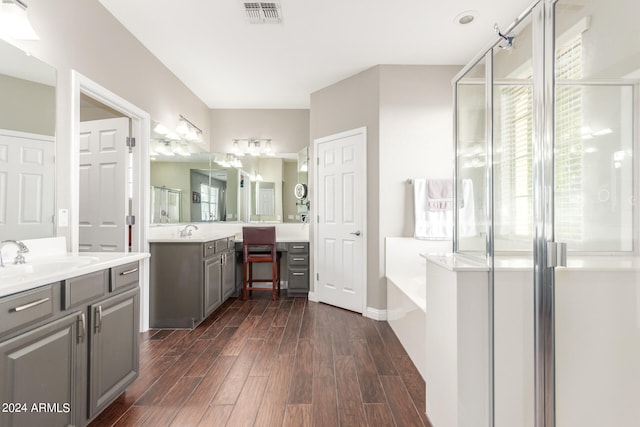 bathroom with vanity and separate shower and tub