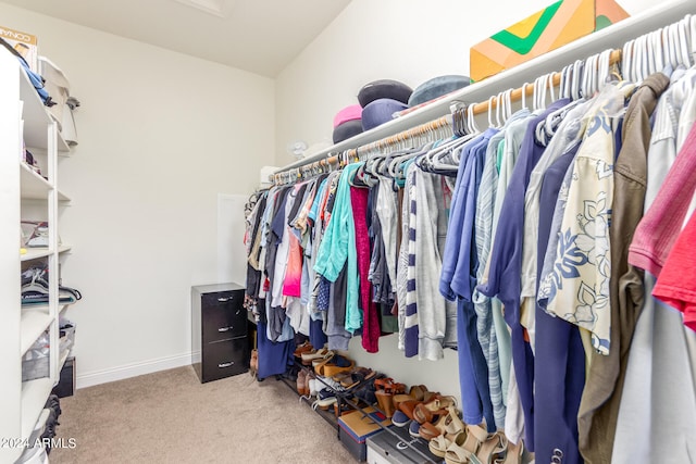 walk in closet featuring carpet