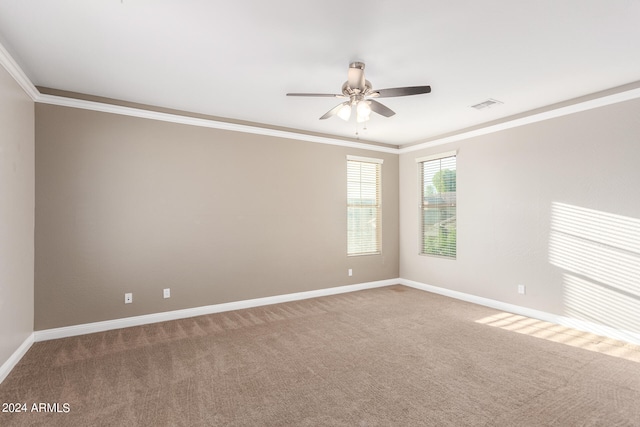 unfurnished room with crown molding, carpet floors, and ceiling fan