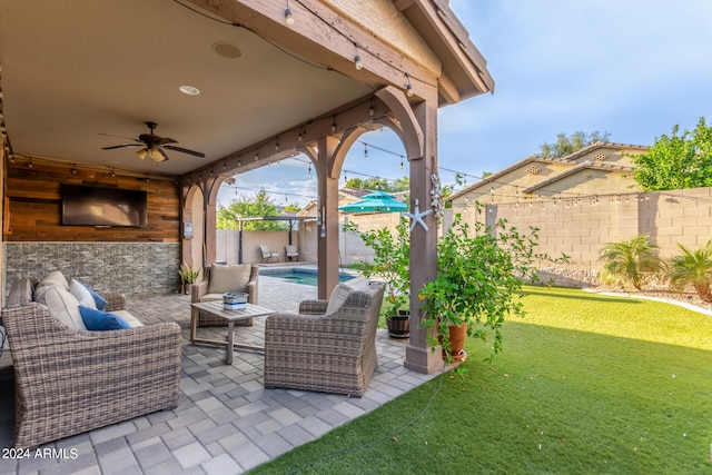 view of patio / terrace with a fenced in pool, an outdoor hangout area, and ceiling fan