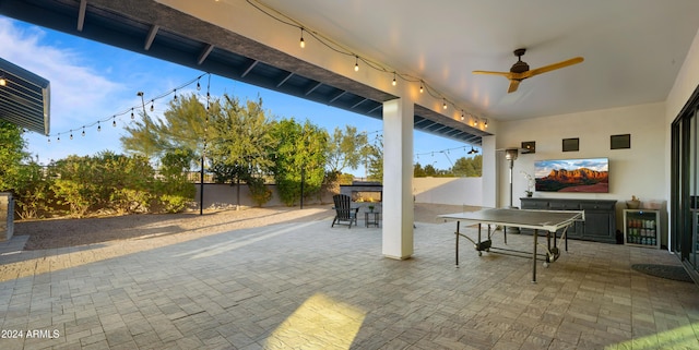 view of patio / terrace with ceiling fan and wine cooler