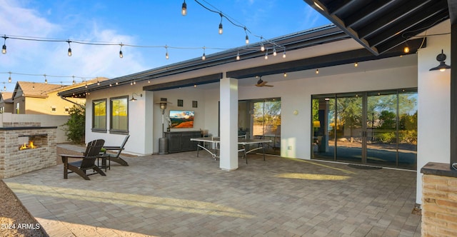 view of patio featuring ceiling fan