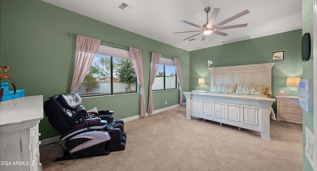 bedroom featuring light carpet and ceiling fan