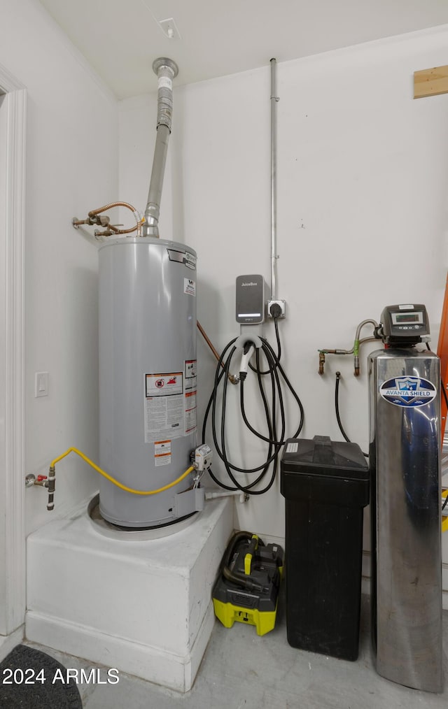 utility room with water heater