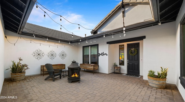 view of patio / terrace featuring a fire pit