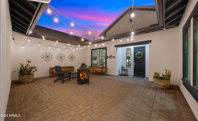 patio terrace at dusk with a fire pit