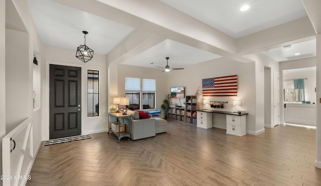 foyer entrance featuring ceiling fan