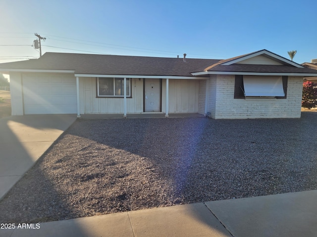 ranch-style house featuring a garage