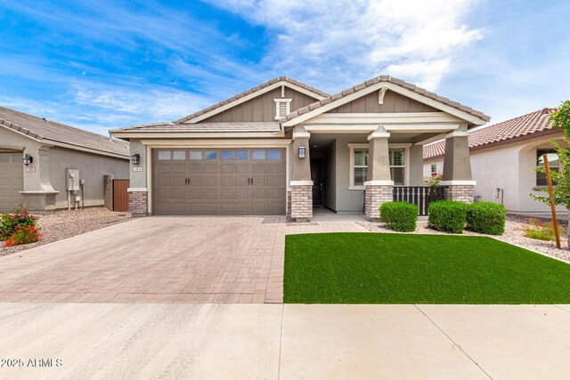 3474 W Dreamy Draw Dr, Queen Creek, AZ 85144 - craftsman-style house with decorative driveway, covered porch, an attached garage, and stucco siding