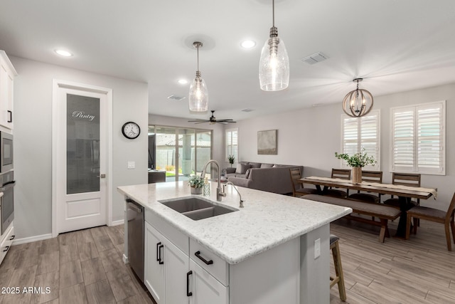 3474 W Dreamy Draw Dr, Queen Creek, AZ 85144 - kitchen with a sink, appliances with stainless steel finishes, pendant lighting, light wood-style flooring, and recessed lighting