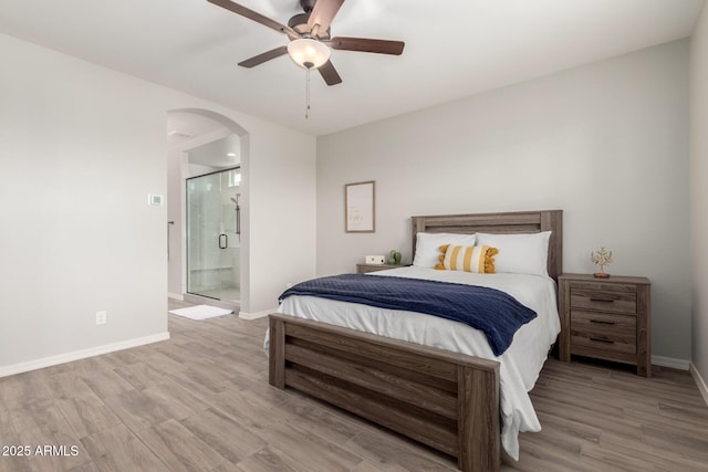 3474 W Dreamy Draw Dr, Queen Creek, AZ 85144 - bedroom with arched walkways, wood finished floors, baseboards, and ensuite bathroom