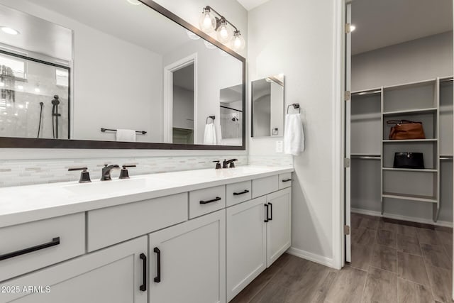 3474 W Dreamy Draw Dr, Queen Creek, AZ 85144 - full bath with a walk in closet, double vanity, decorative backsplash, and a shower stall