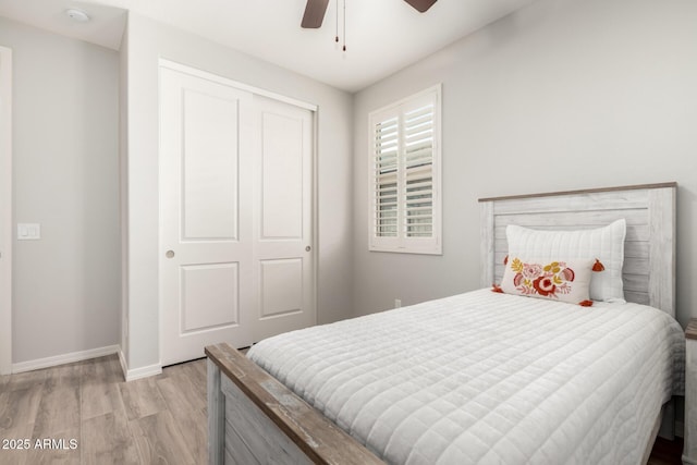 3474 W Dreamy Draw Dr, Queen Creek, AZ 85144 - bedroom with light wood-style flooring, baseboards, a closet, and a ceiling fan