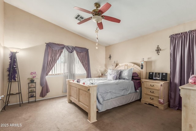bedroom with a ceiling fan, visible vents, and light colored carpet