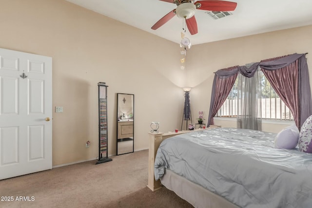bedroom featuring lofted ceiling, visible vents, ceiling fan, and light carpet