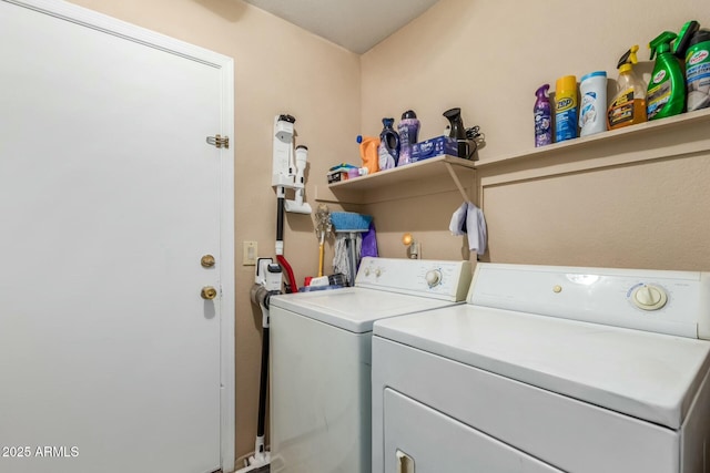 washroom with laundry area and washer and clothes dryer
